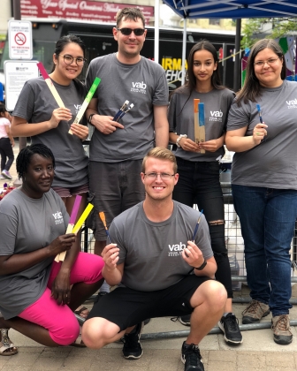 Group Photo of Visual Arts Brampton Volunteers Holding Paint Brushes